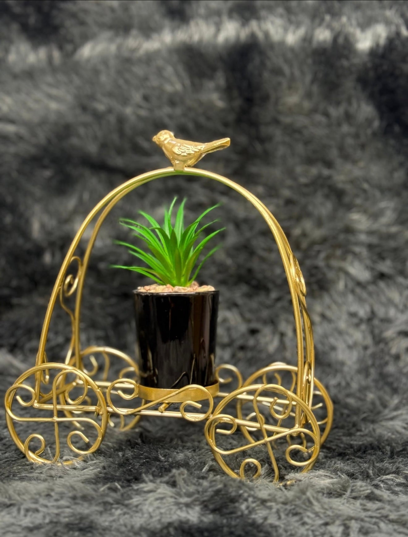 Sparrow design golden metal cart.